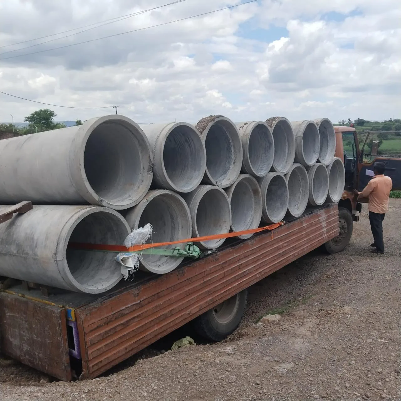 Truck loaded with RCC pipes ready for delivery across Maharashtra by Gurukrupa Enterprises